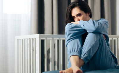 unhappy woman suffering from postpartum depression